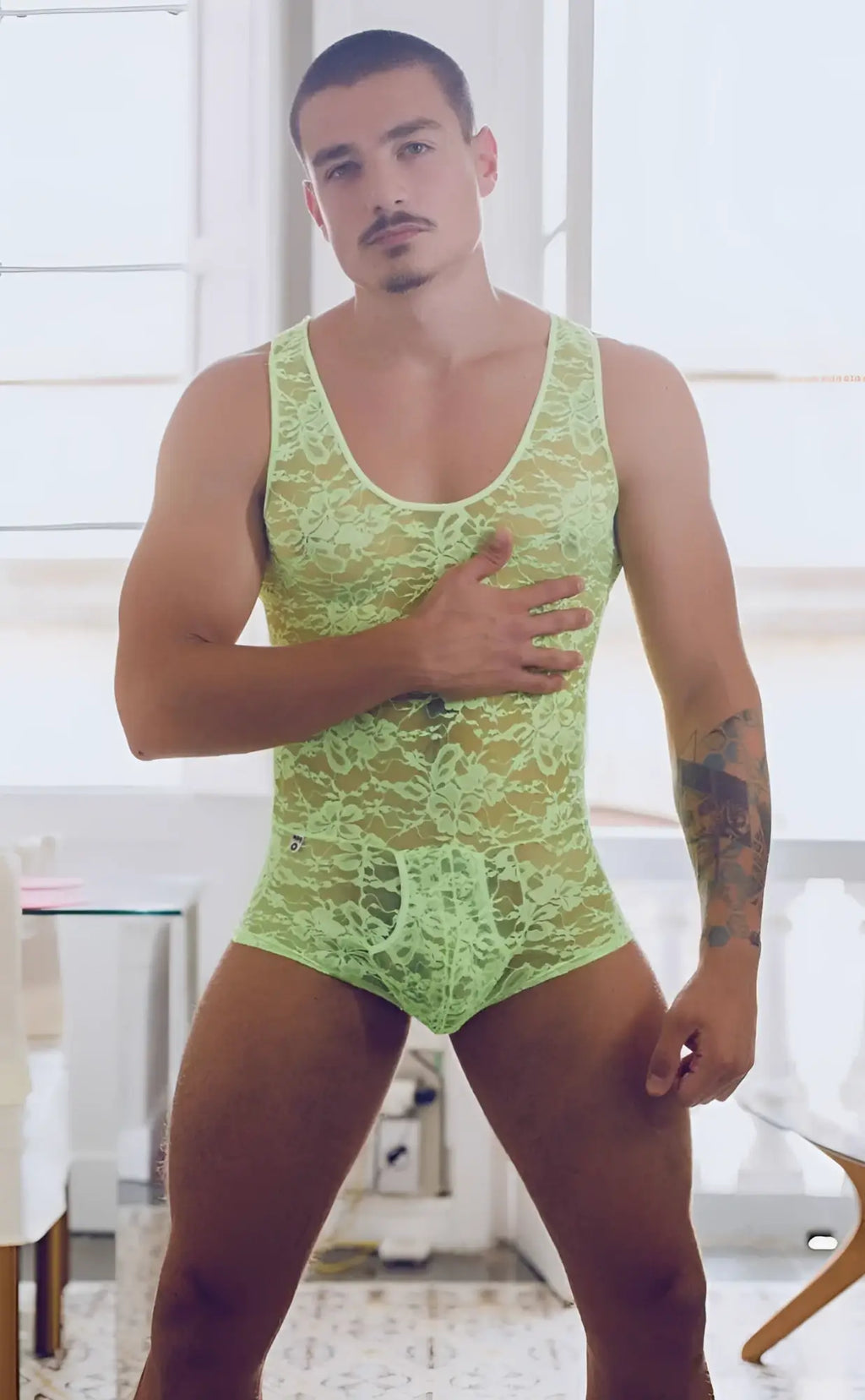 MOB men’s lime green lace bodysuit with intricate floral patterns made from delicate lace material