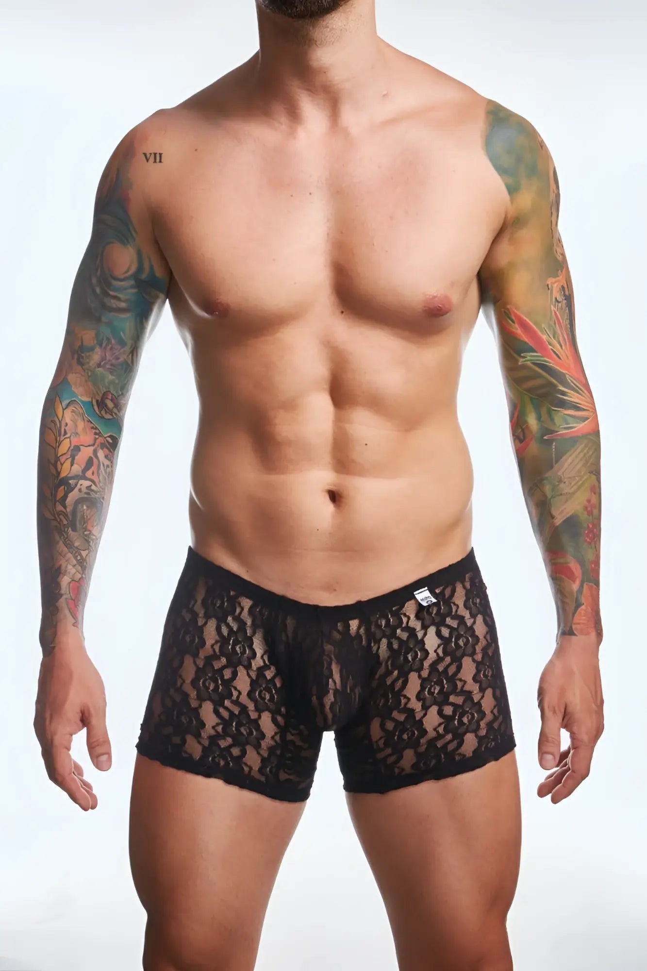 Black lace boxer briefs with delicate floral pattern and solid black waistband from MOB men’s lace boxer collection