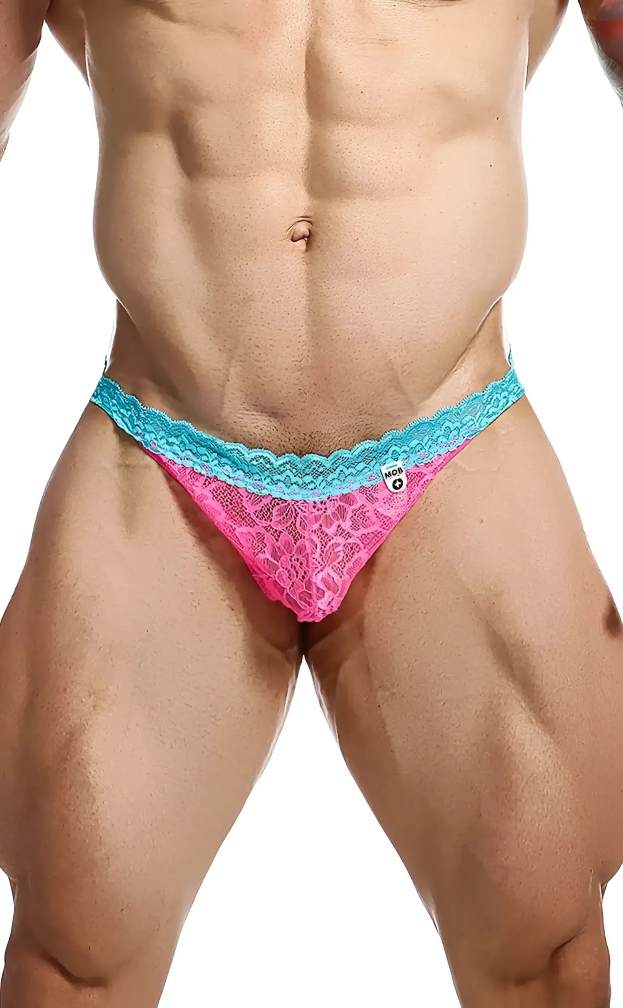 Pink lace thong with turquoise scalloped edge from mob men’s lace jockstrap shown from the back side