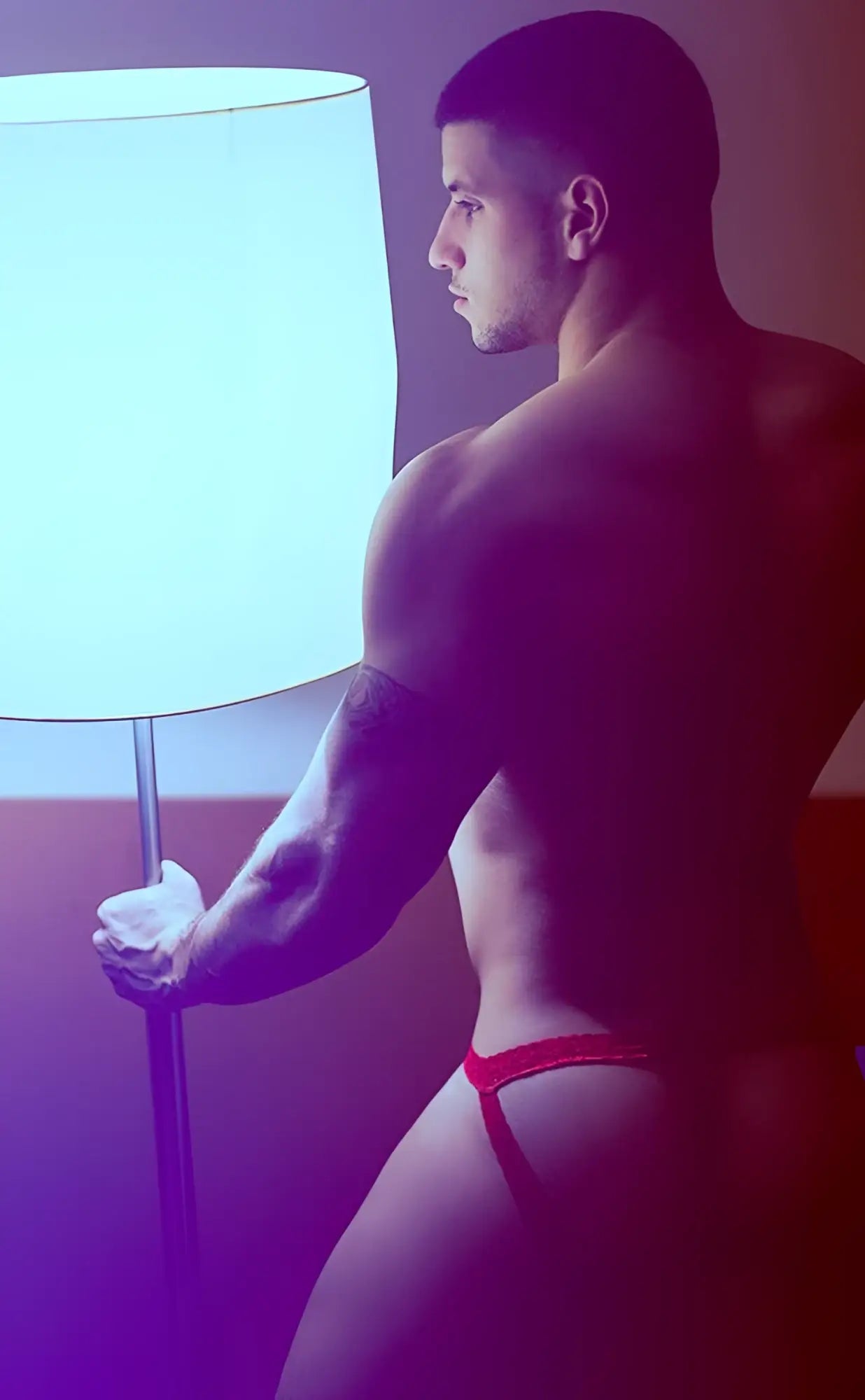 Red lace thong briefs by mob featuring a lace jockstrap design for men’s intimate wear