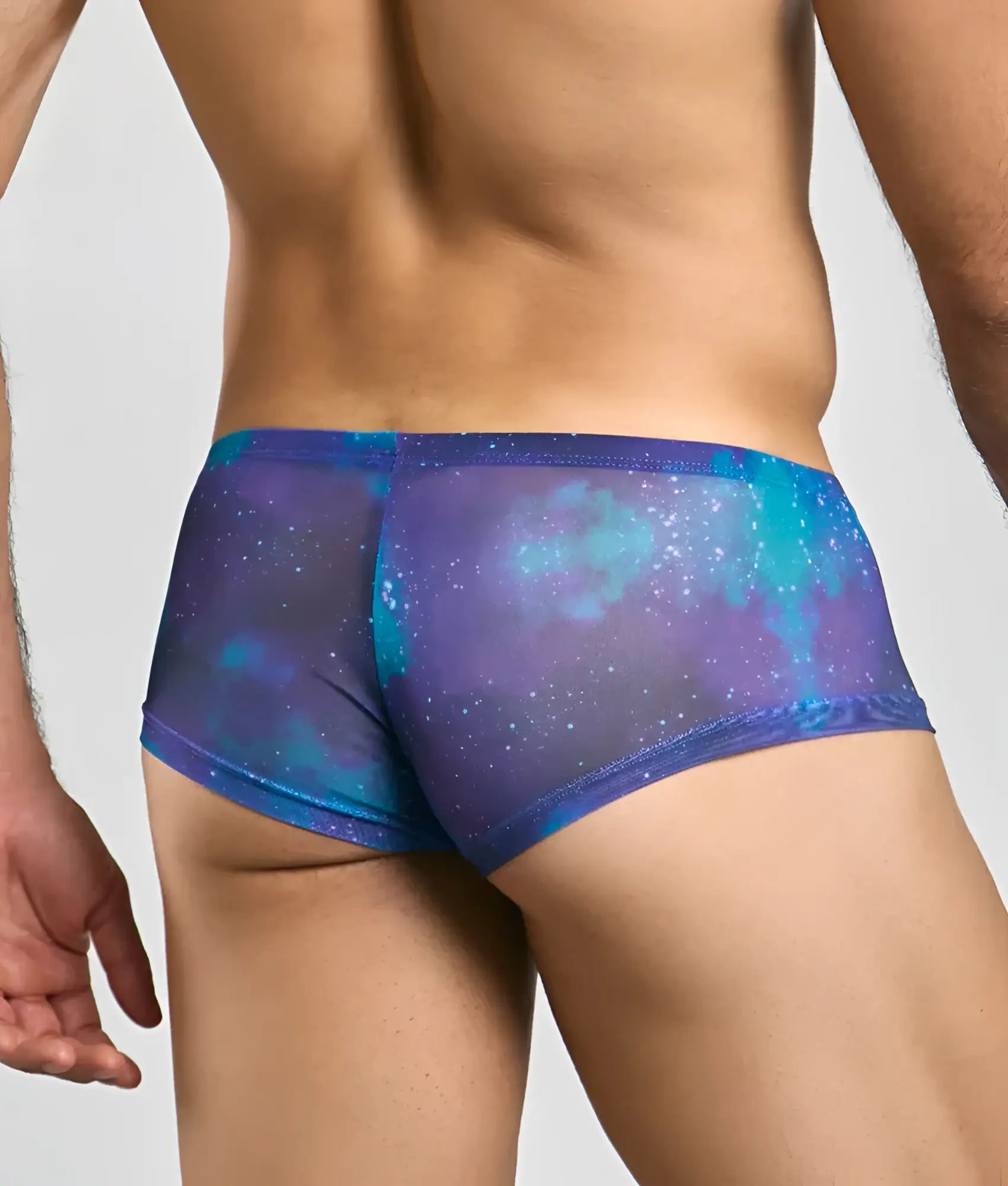 Mob men’s sexy sheer hip brief in blue and purple galaxy-patterned mesh showing front view