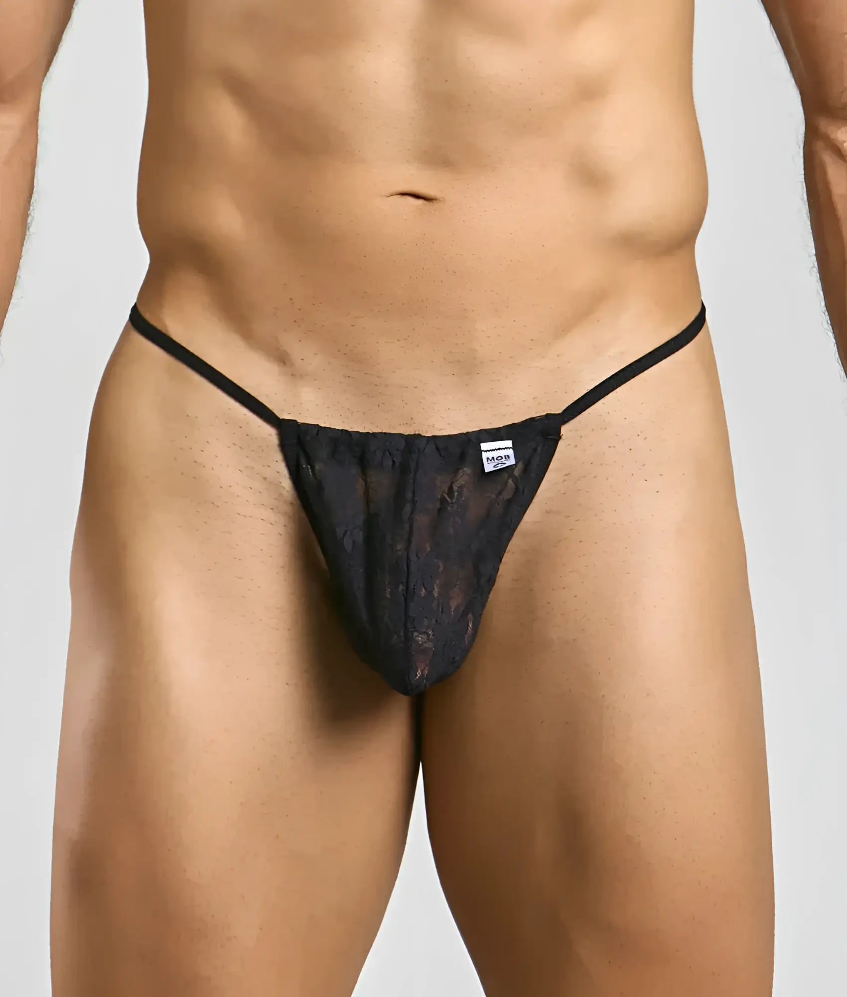 Black lace thong g-string with thin straps and small brand tag at waistband shown from the back in MOB Print New collection