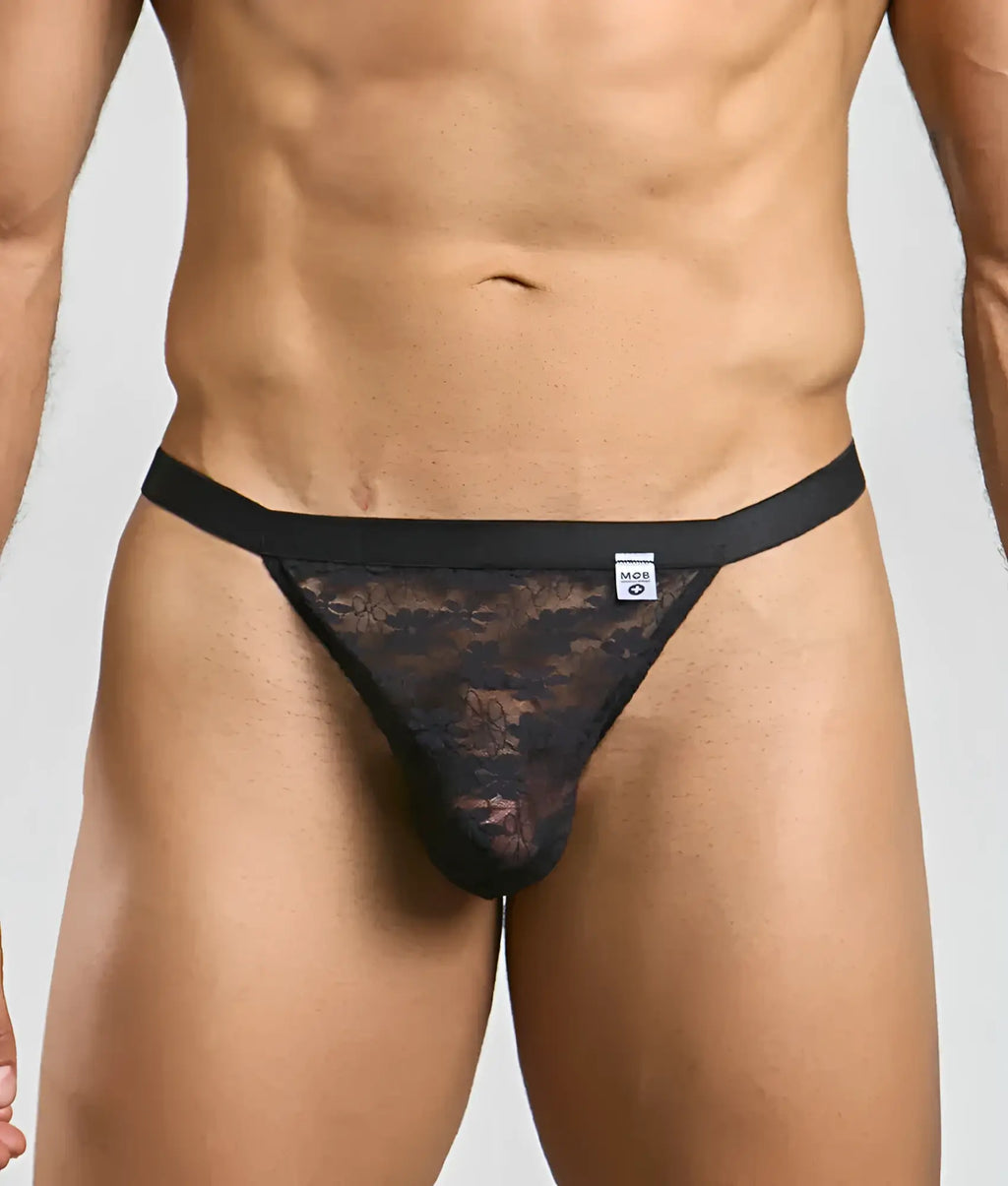 Black lace thong with solid black waistband and subtle pattern from mob sexy mesh and lace jockstrap front view