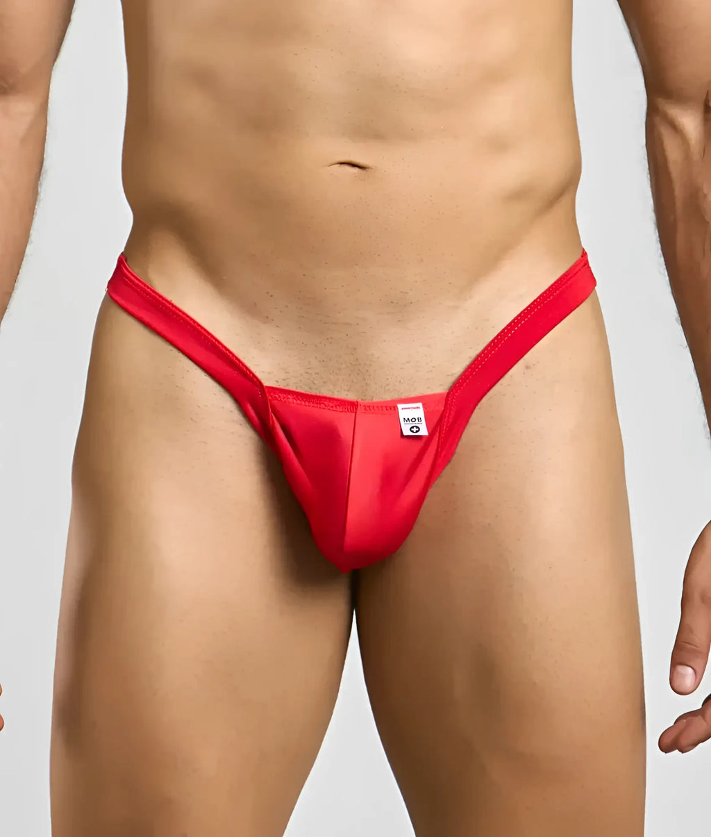 Red thong mob y buns thong with a small white tag at the center front designed for comfortable everyday wear