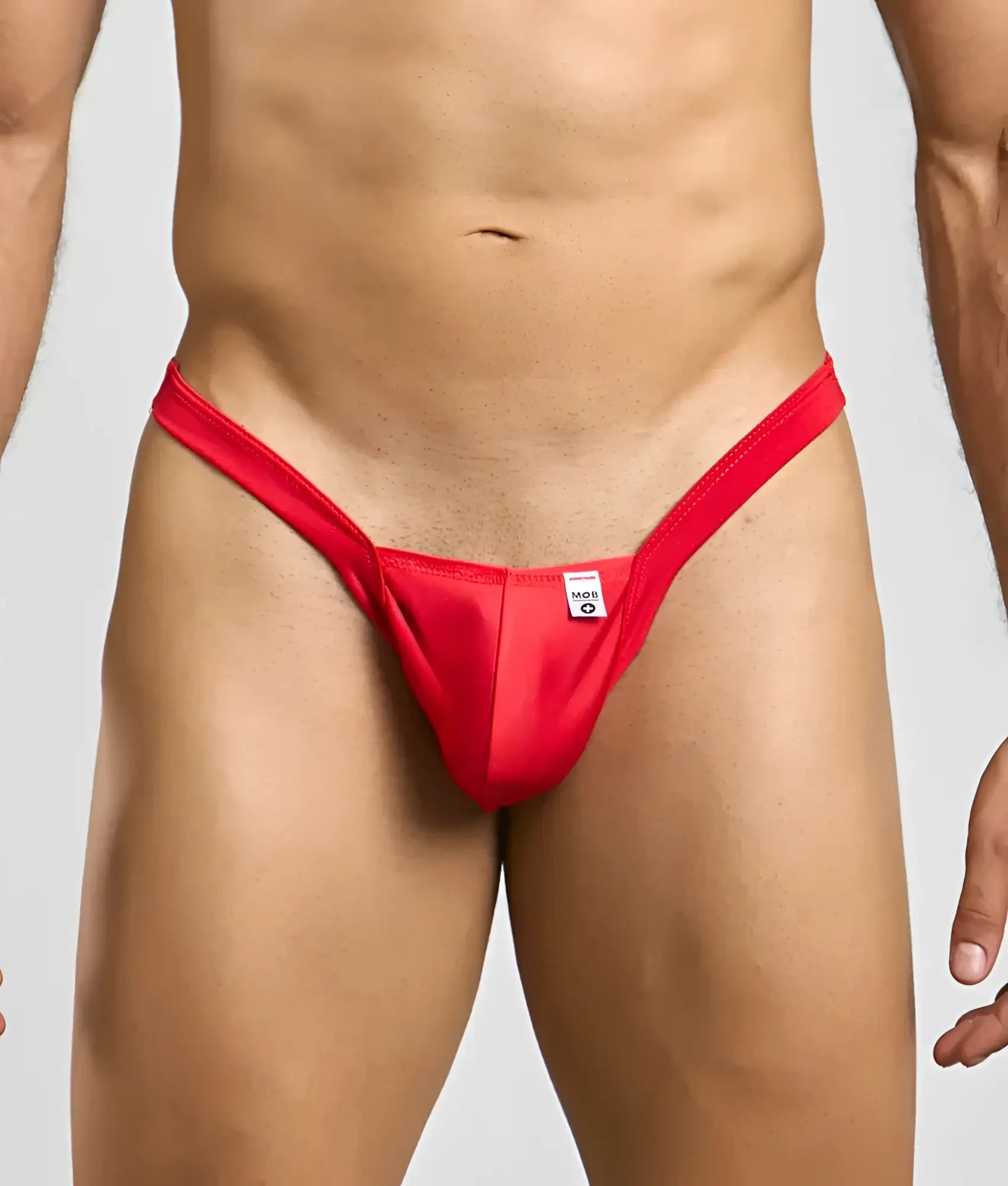Red thong mob y buns thong with a small white tag at the center front designed for comfortable everyday wear