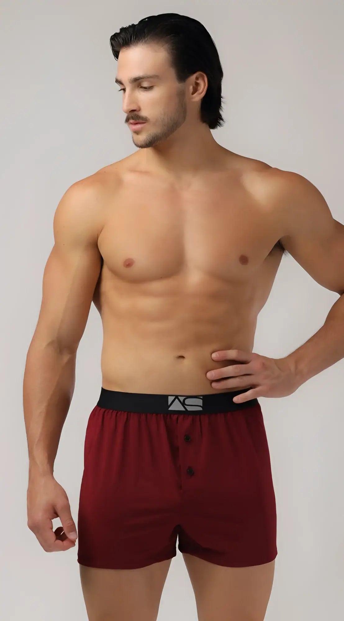 Maroon cotton modern boxer shorts with black elastic waistband and white logo for comfortable everyday wear