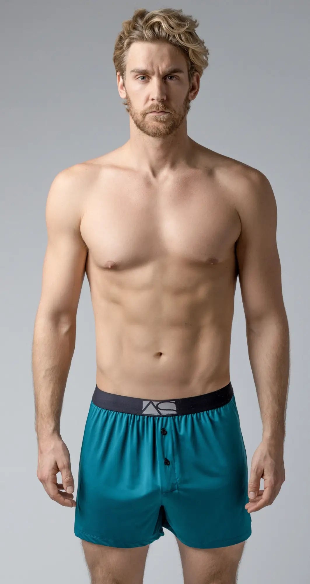 Modern boxer teal satin boxer shorts with black elastic waistband silver logo and three front buttons
