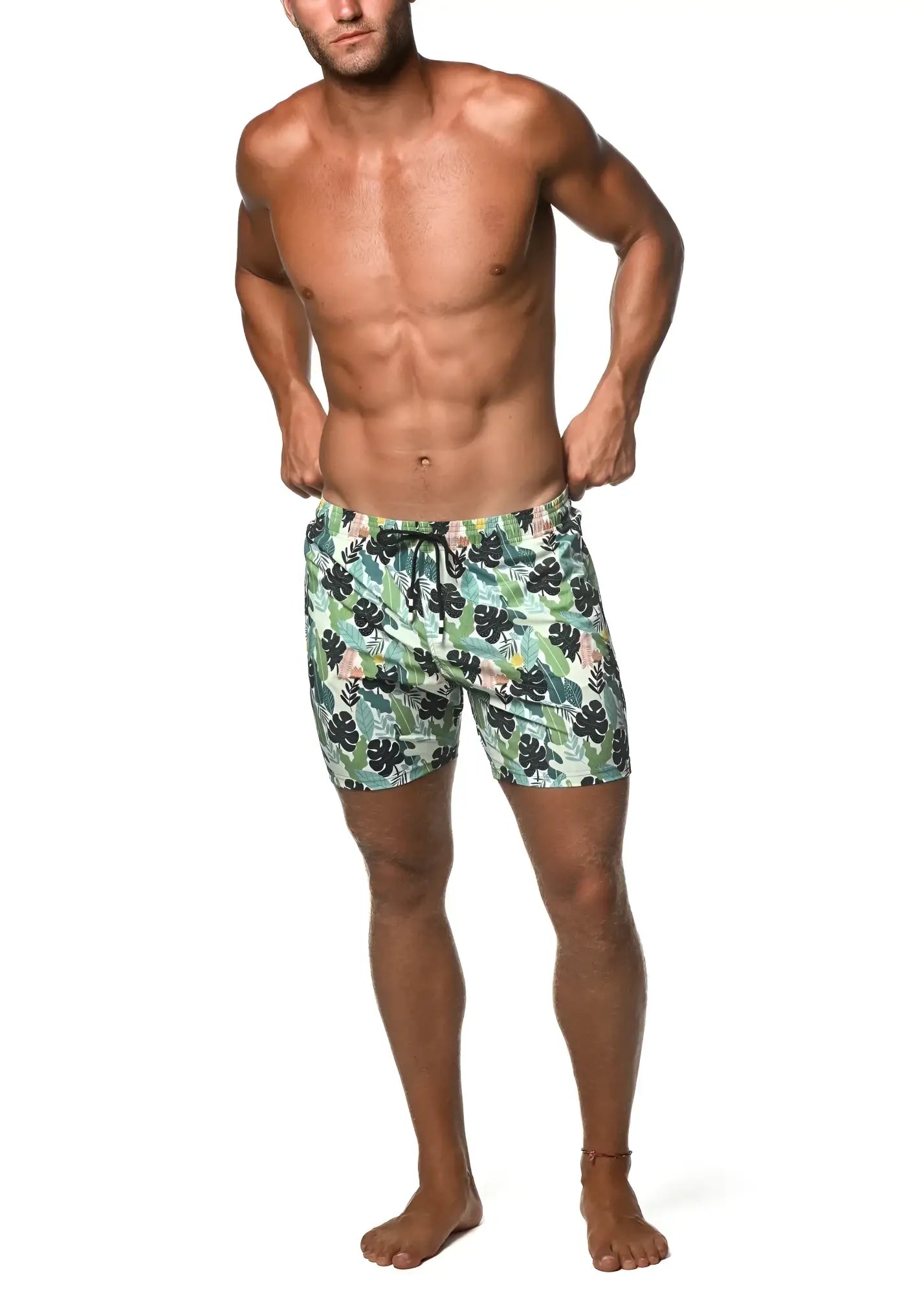 Men’s moritz 6 inch inseam swim shorts with light green and black tropical leaf pattern for beach and pool use