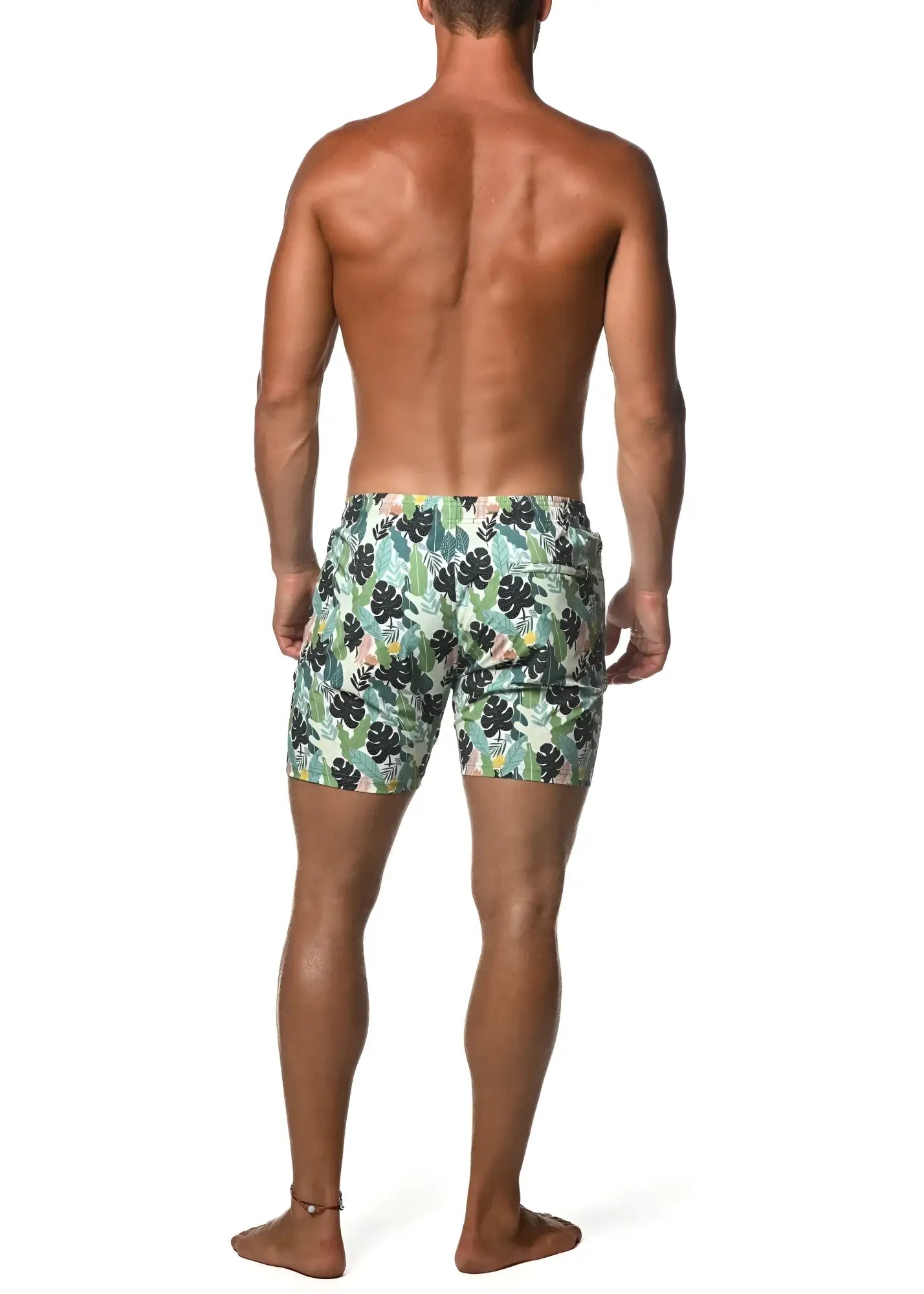Moritz 6 inch inseam swim short with men’s light green and black tropical leaf patterned swim trunks front view