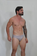 Patterned gray and white geometric mosaico swim brief designed for comfortable swimwear use