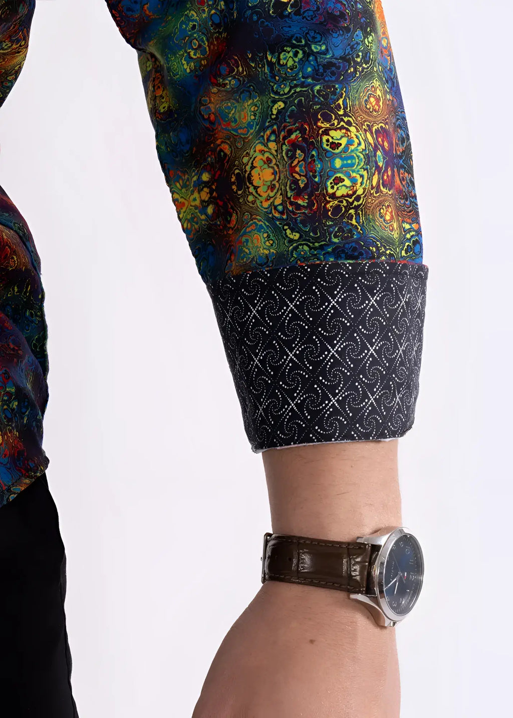 Multicolor patterned l/s shirt with vibrant mandala sleeve and dark navy cuff featuring white geometric design