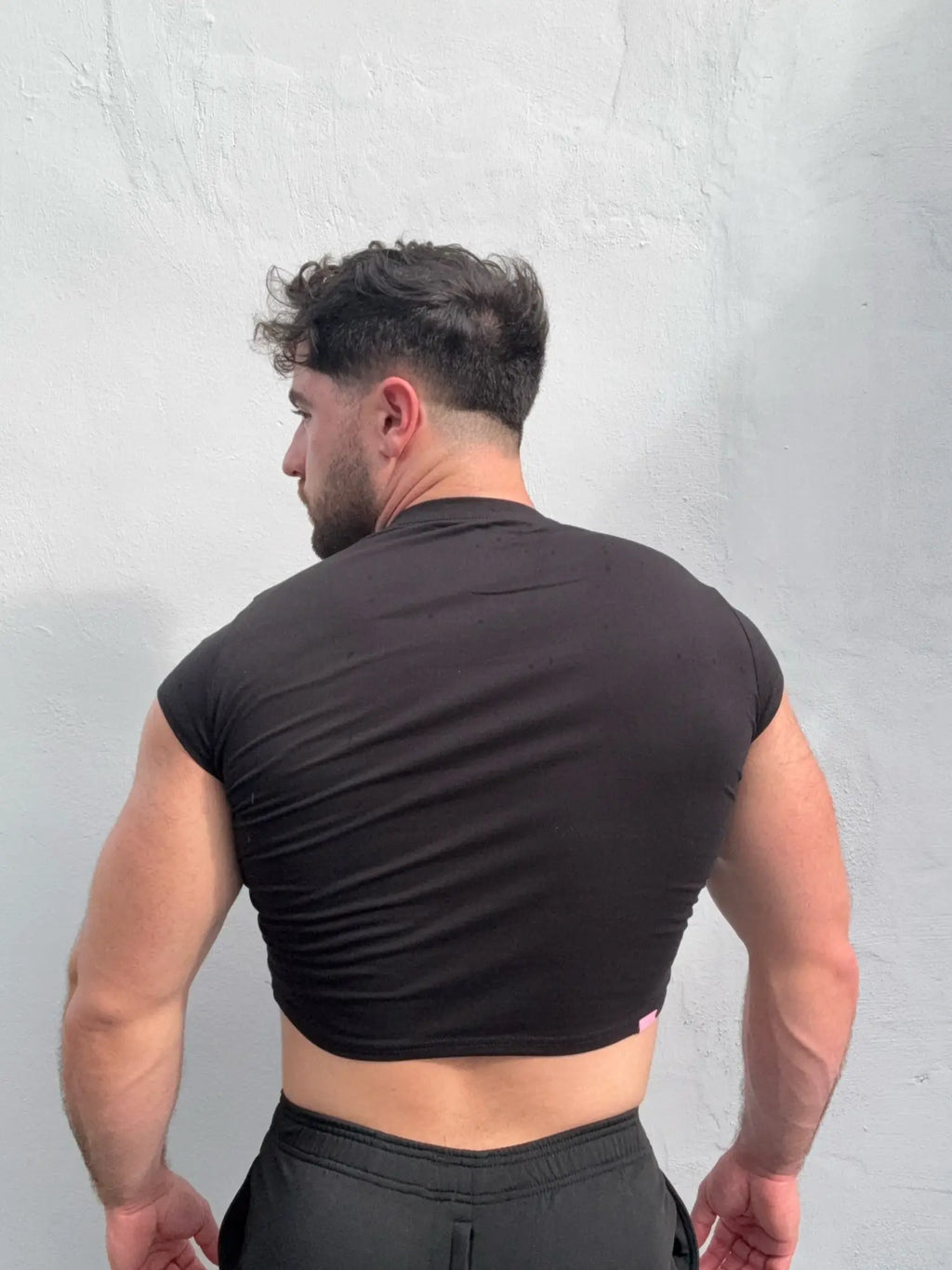 Muscle-fit crop half-sleeve tee black made of soft breathable fabric perfect for casual wear and workouts