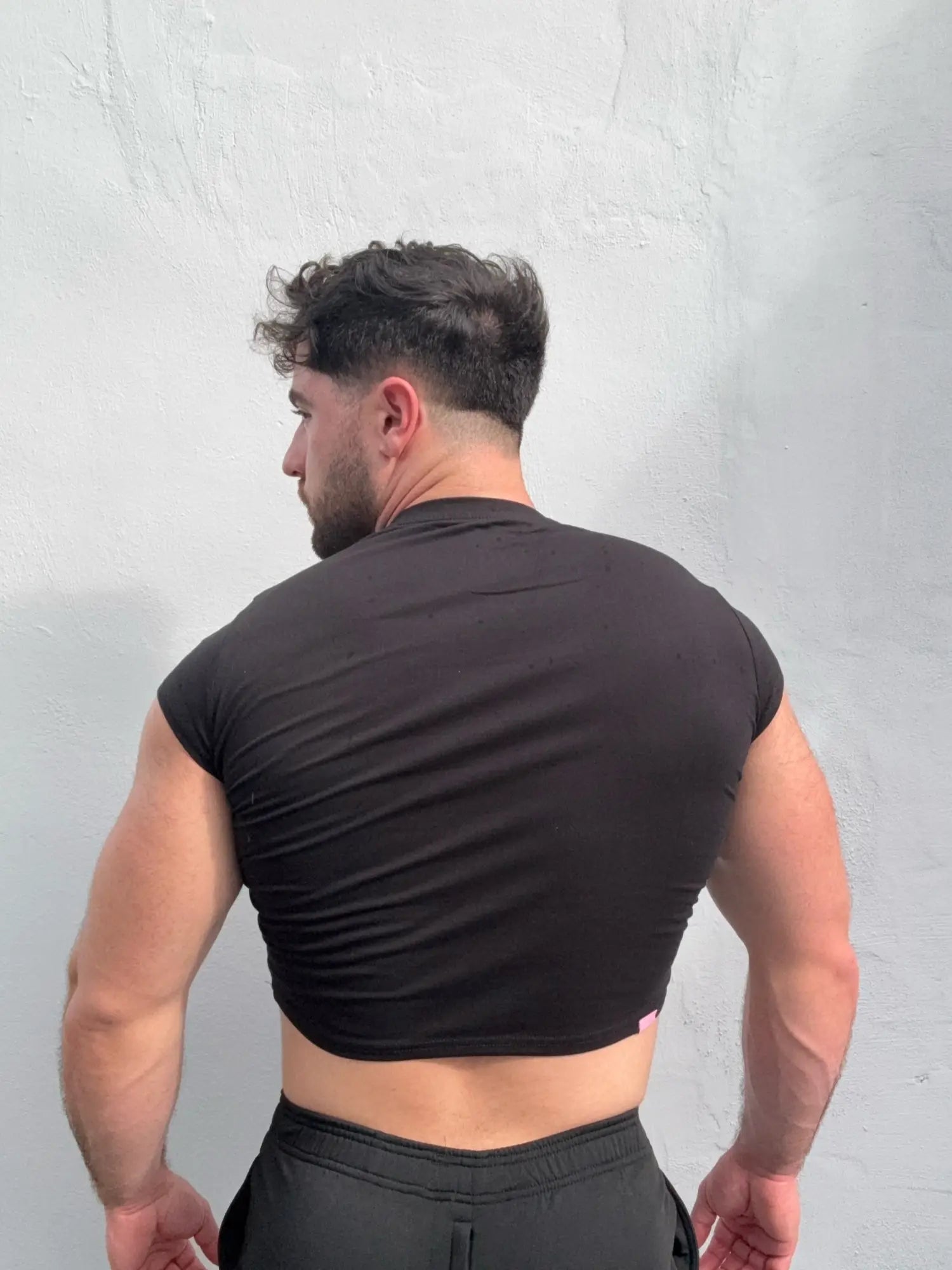 Muscle-fit crop half-sleeve tee black made of soft breathable fabric perfect for casual wear and workouts