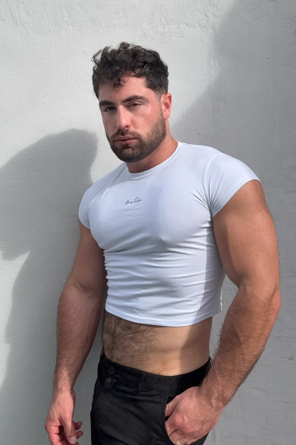 White muscle-fit crop half-sleeve t-shirt with subtle embroidered logo on chest in soft breathable fabric