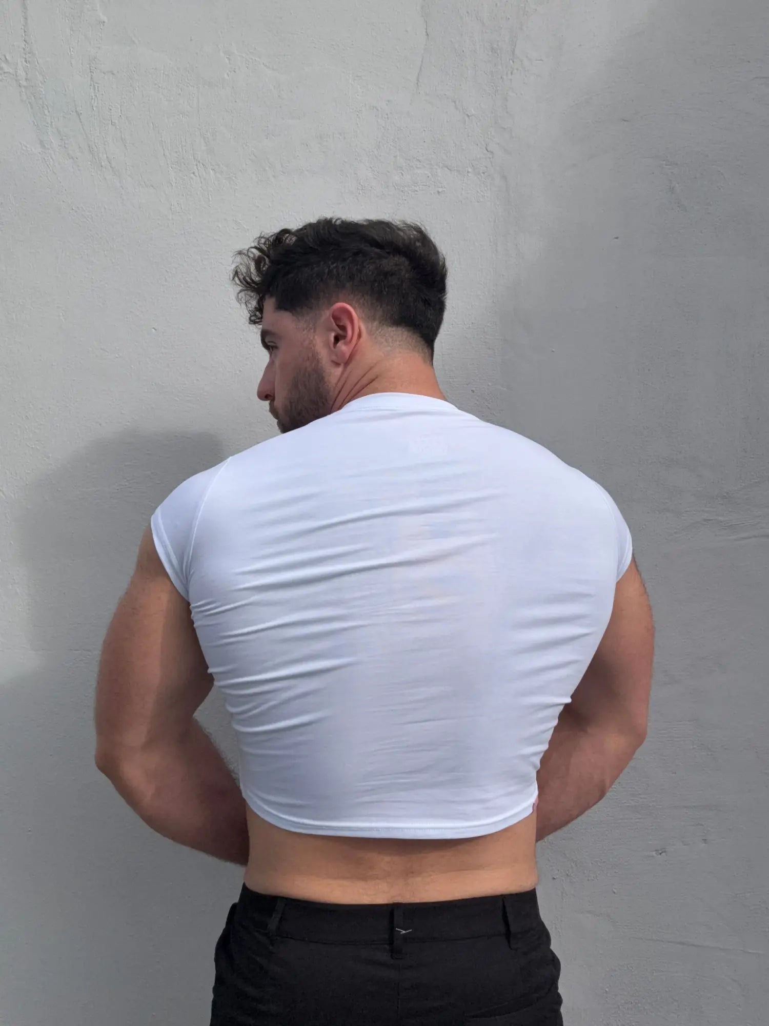 White muscle-fit crop half-sleeve tee made of breathable fabric ideal for athletic and casual wear