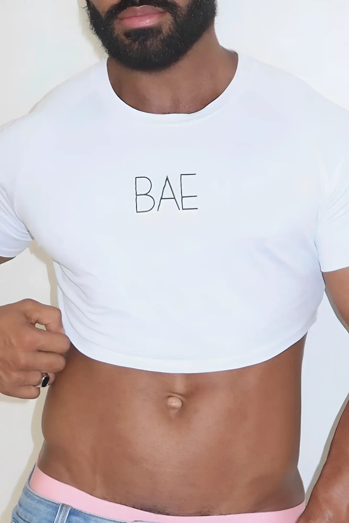 White muscle-fit cotton crop tee with bae printed in black uppercase letters across the chest for casual wear