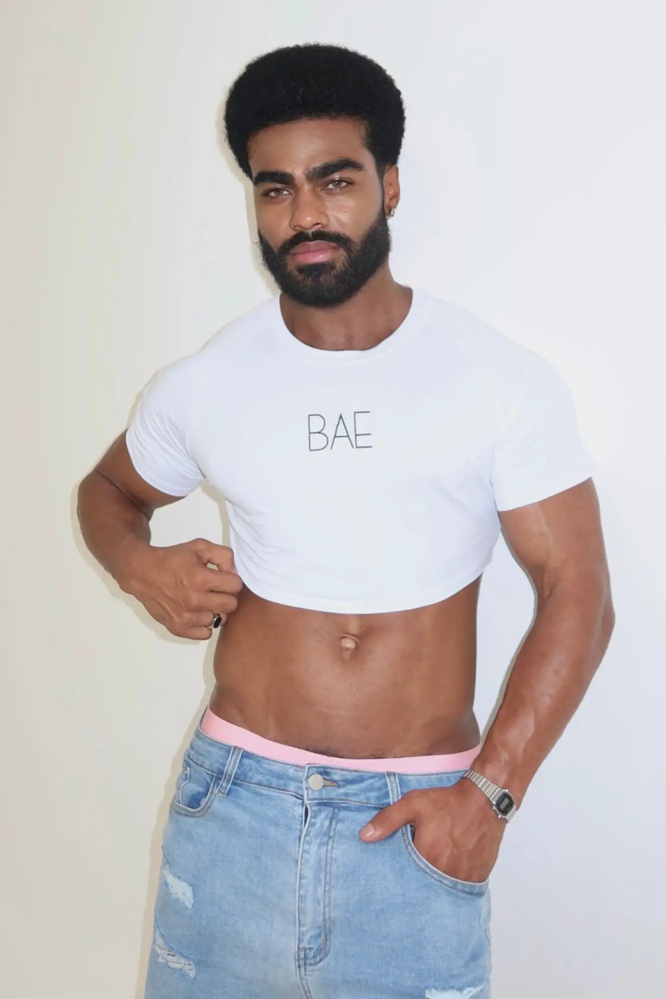 White muscle-fit crop tee with bae printed in black lettering across the chest for casual daylight wear