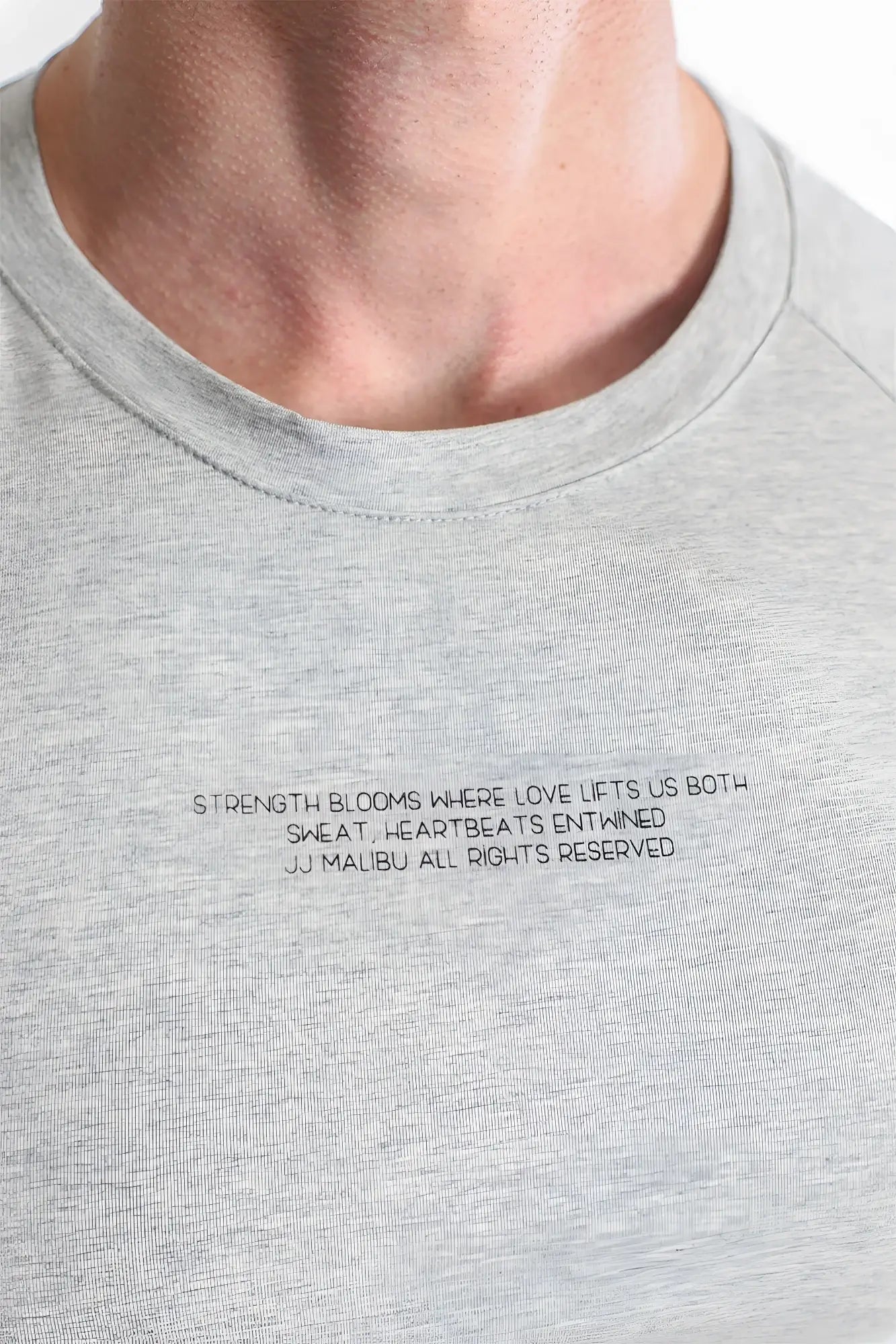Gray heathered cotton muscle-fit crop tee with black embroidered text across the chest free verse design