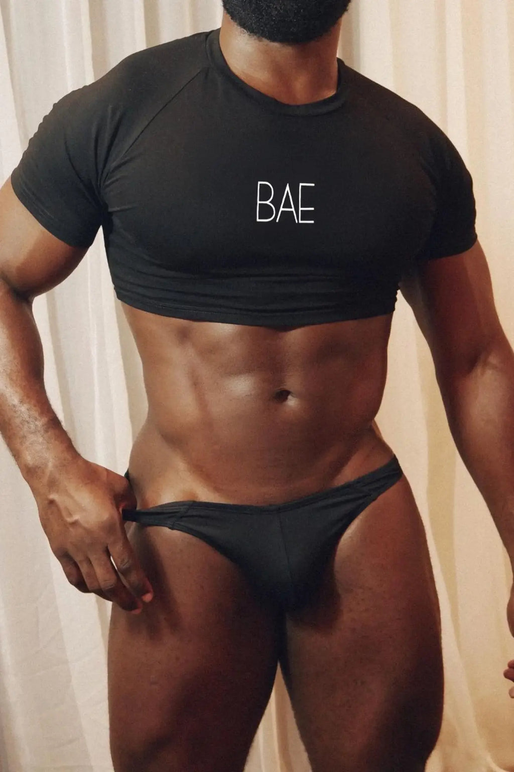 Black muscle-fit crop tee with white bae print on the chest perfect for casual and stylish wear