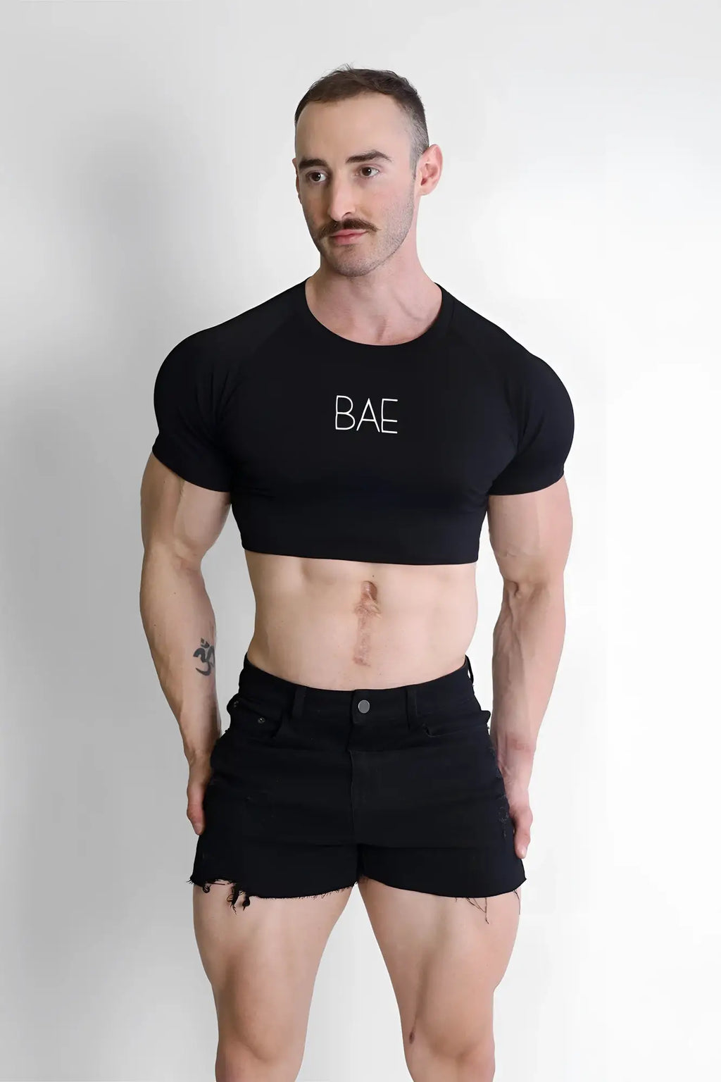 Black muscle-fit cropped cotton t-shirt with bae printed in white letters across the chest for casual wear