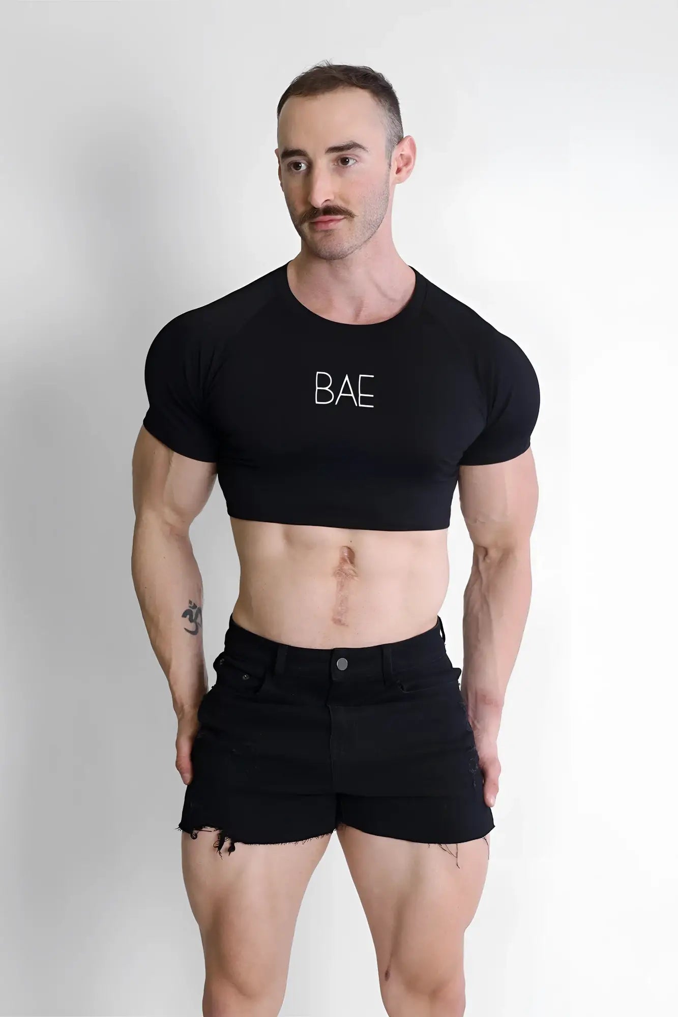 Black muscle-fit cropped cotton t-shirt with bae printed in white letters across the chest for casual wear