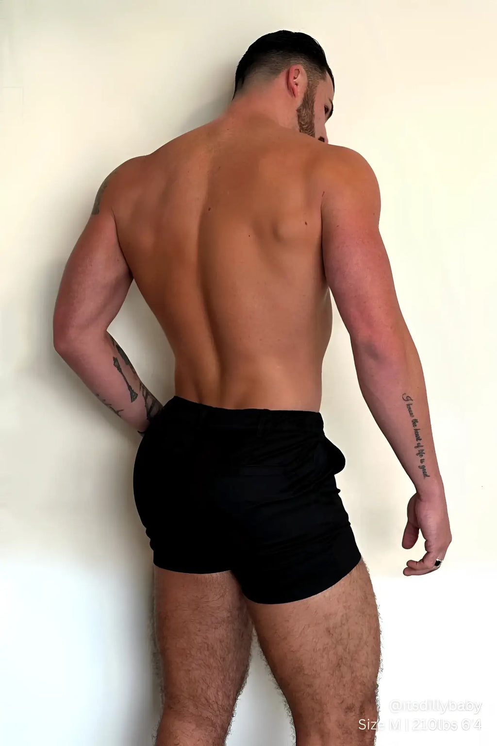 Muscle-fit men’s 4 inch stretchy chino shorts in jet black with a simple sleek design and athletic fit