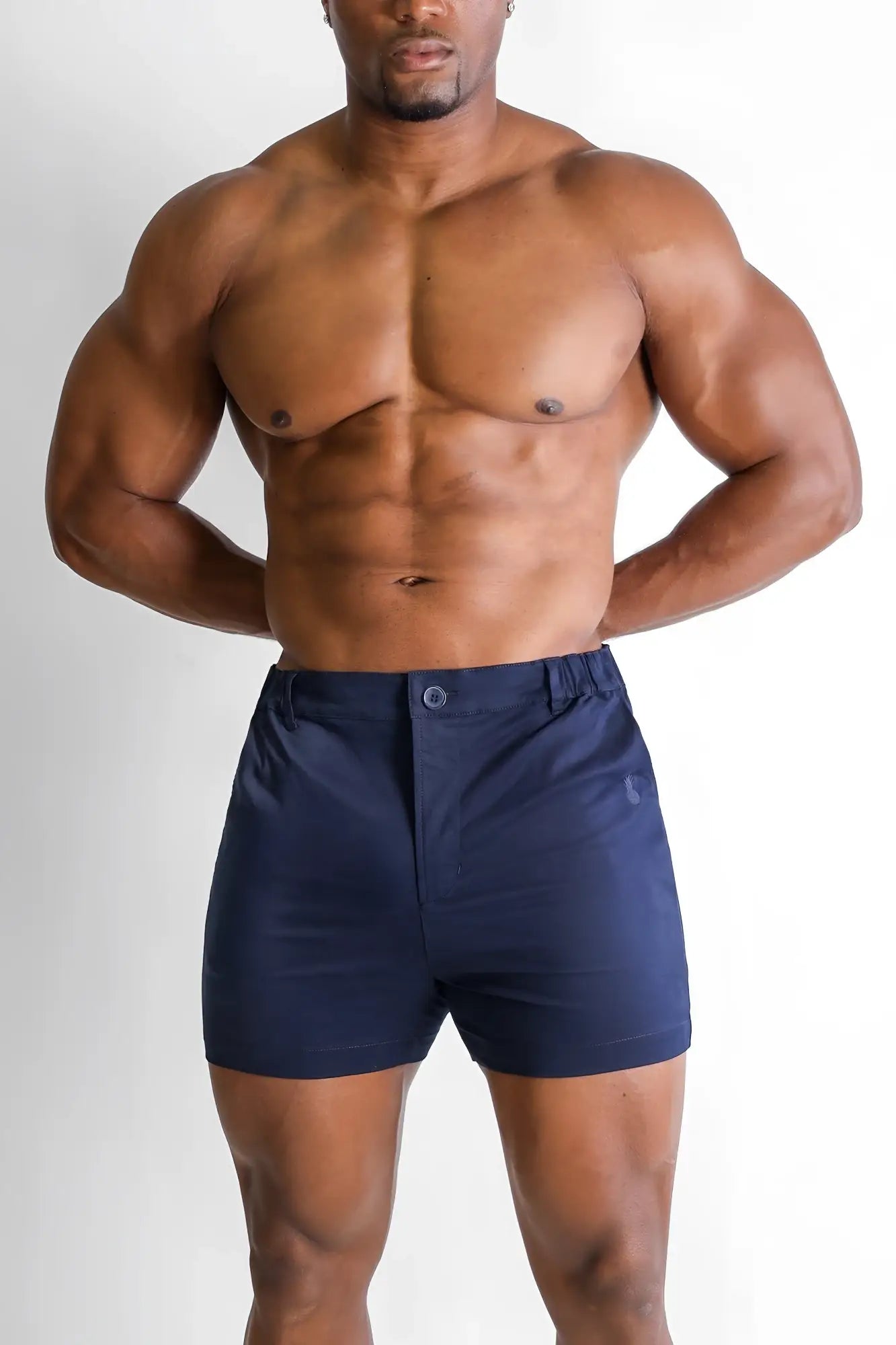 Muscle-fit men’s navy chino shorts with stretchy fabric button closure and subtle side pocket detailing