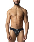Black barbed wire jockstrap with white lightning bolt design and logo on waistband for athletic use
