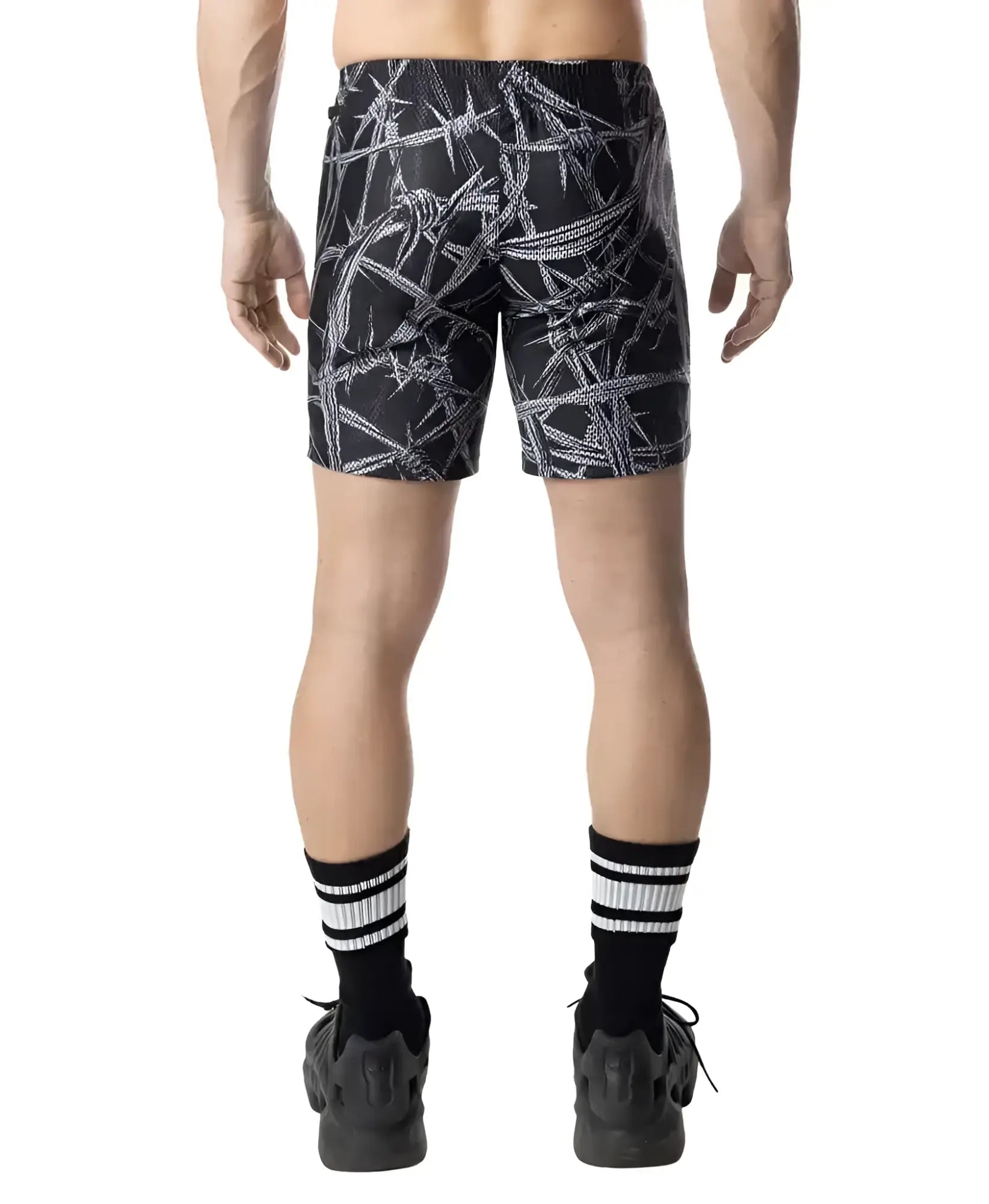 Black rugby shorts with white barbed wire pattern designed for durable athletic wear
