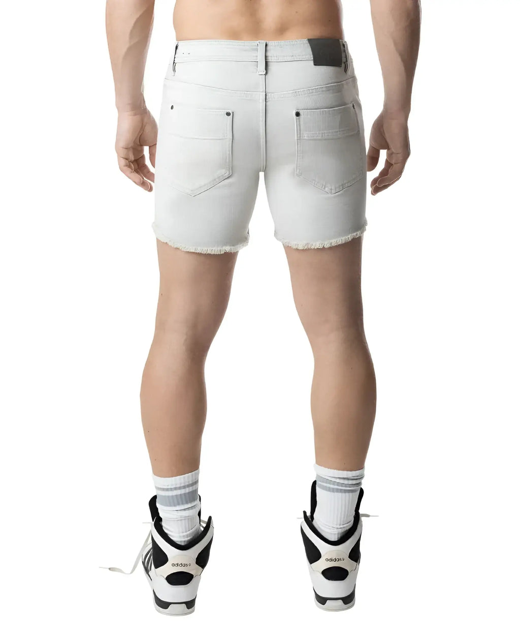 Back view of quad short bleached light-wash denim shorts with frayed hem and back pockets