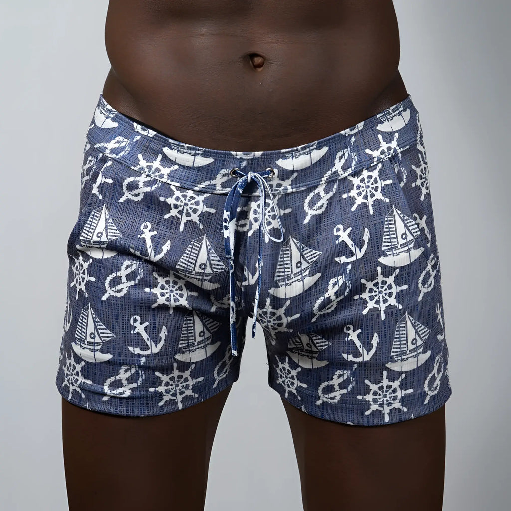 Nautical linen texture shorts navy blue swim trunks with white anchors sailboats and ship wheels pattern