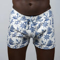 White linen nautical linen texture shorts with blue anchor sailboat and ship wheel pattern
