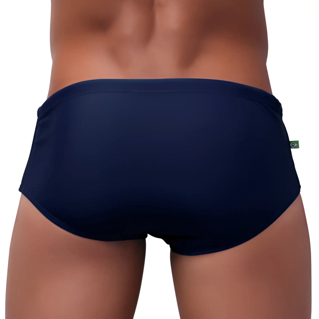 Navy blue men’s swimming sunga with a small green and white flag tag on the waistband clearance final sales