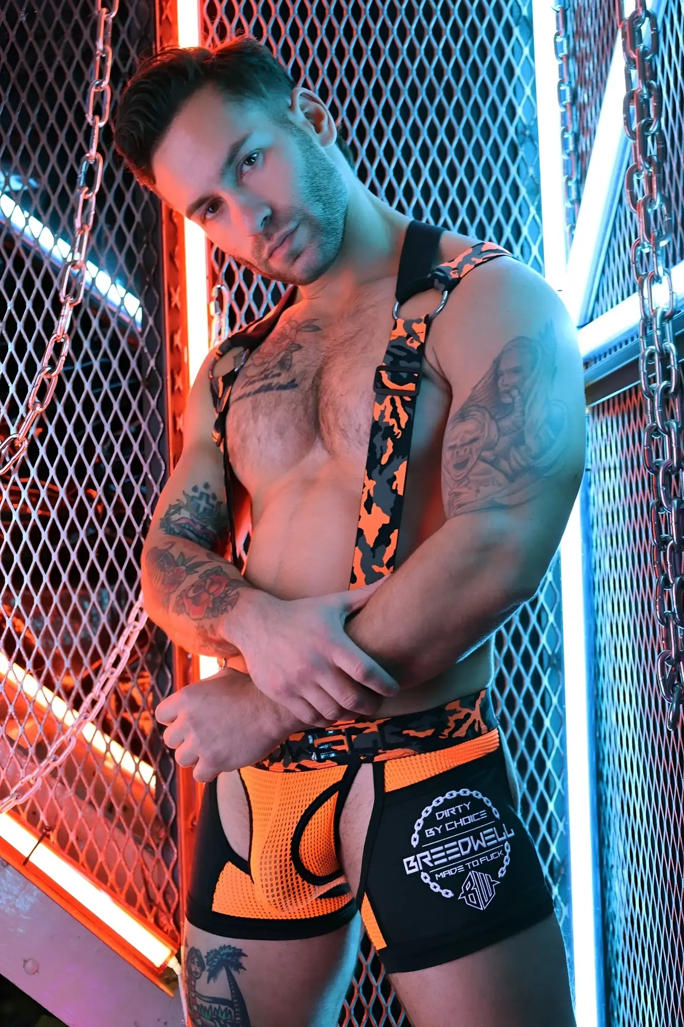Neo camo 3-way harness orange and black patterned suspenders with chain detail designed for versatile wear