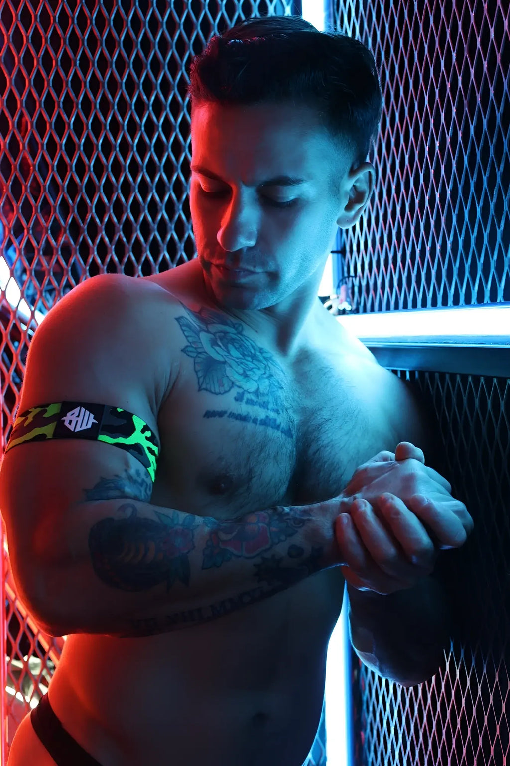 Neo camo armband wristband in black and neon green camouflage pattern with a white logo for active wear