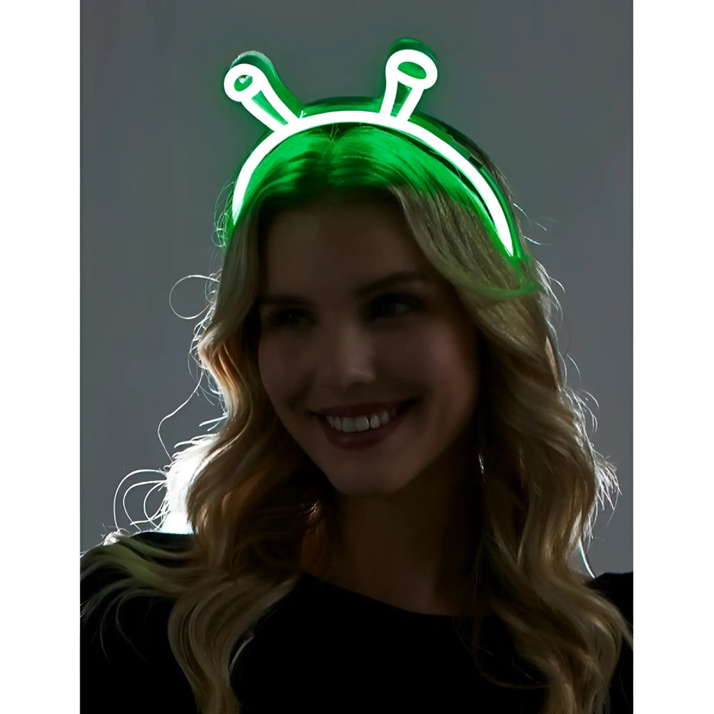 Green neon alien headband with glowing antennae made of flexible plastic for fun costume or party use