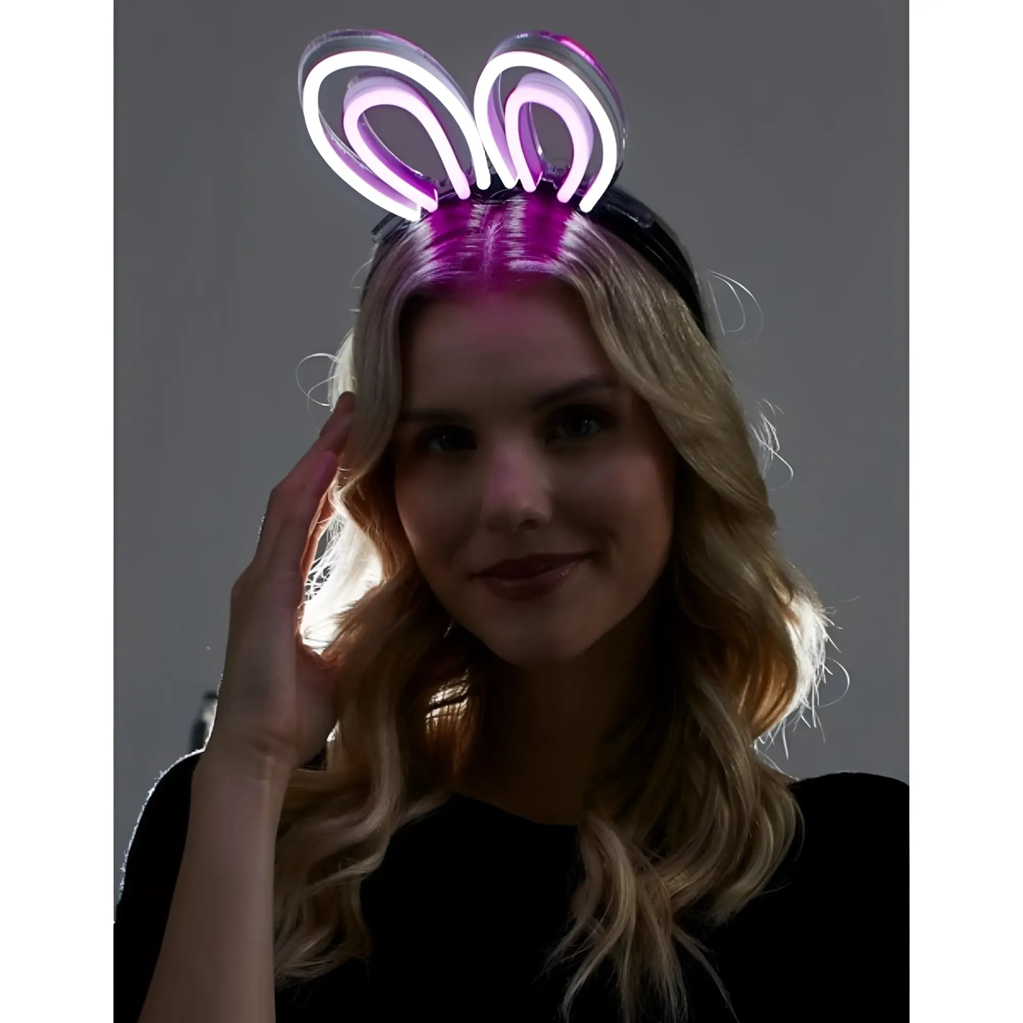 Purple neon bunny ears headband made of glowing flexible material for fun party and costume use