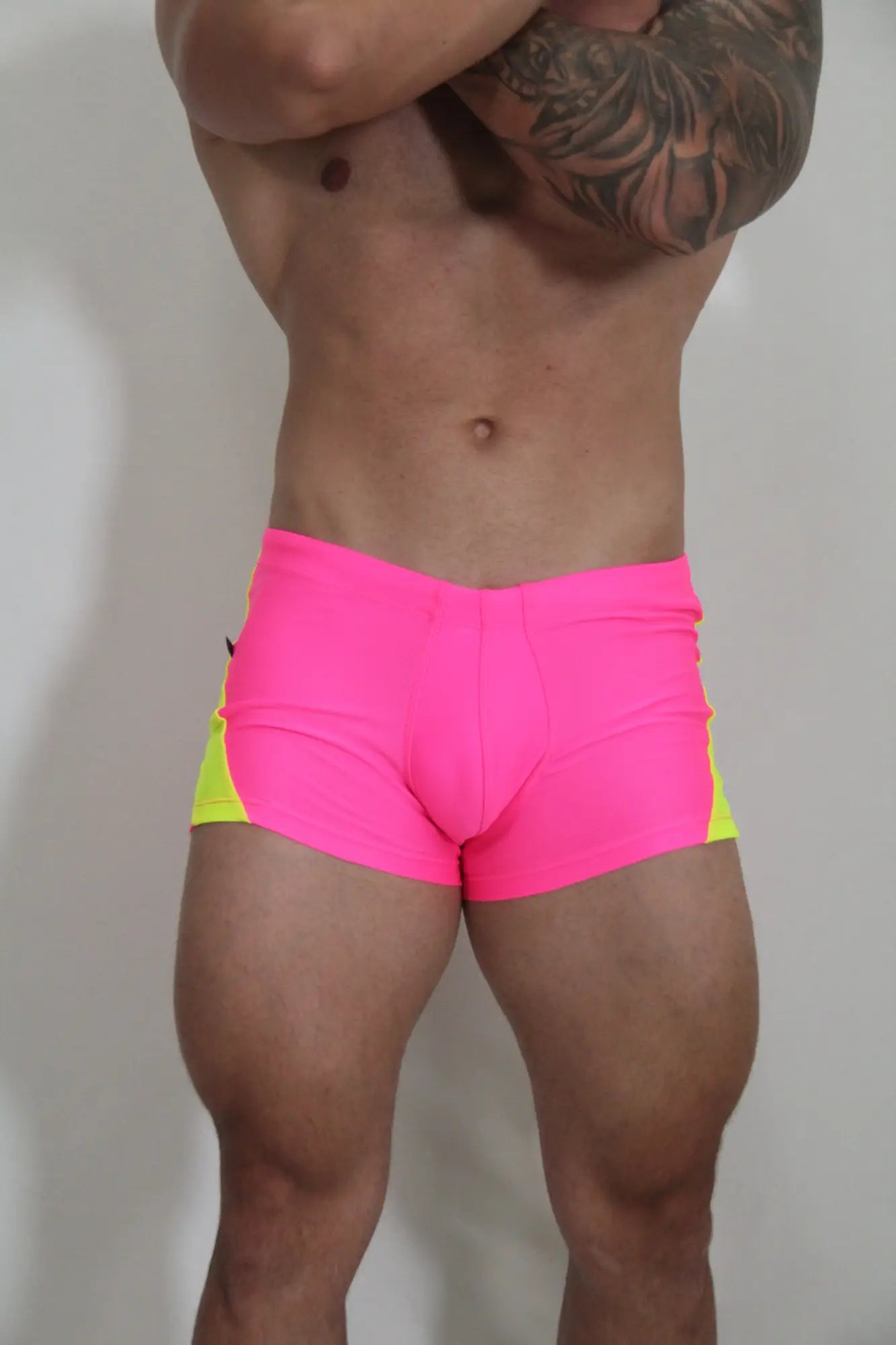 Neon curved sq cut trunk bright pink and neon yellow snug form-fitting athletic swim trunks for swimming and training
