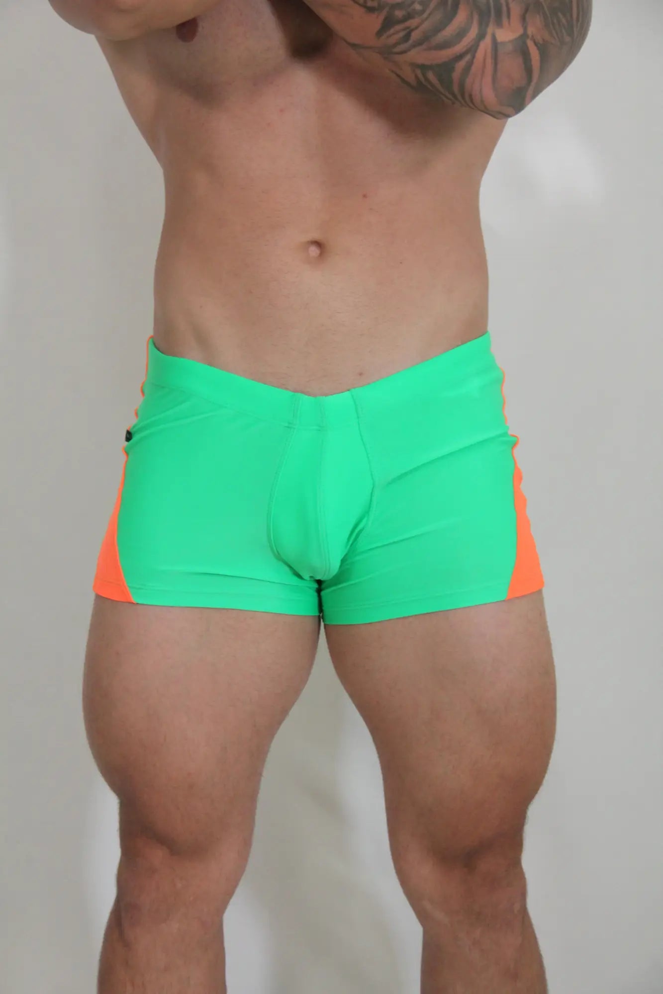 Neon curved sq cut trunk vibrant neon green and orange athletic briefs with sleek form-fitting design for activewear