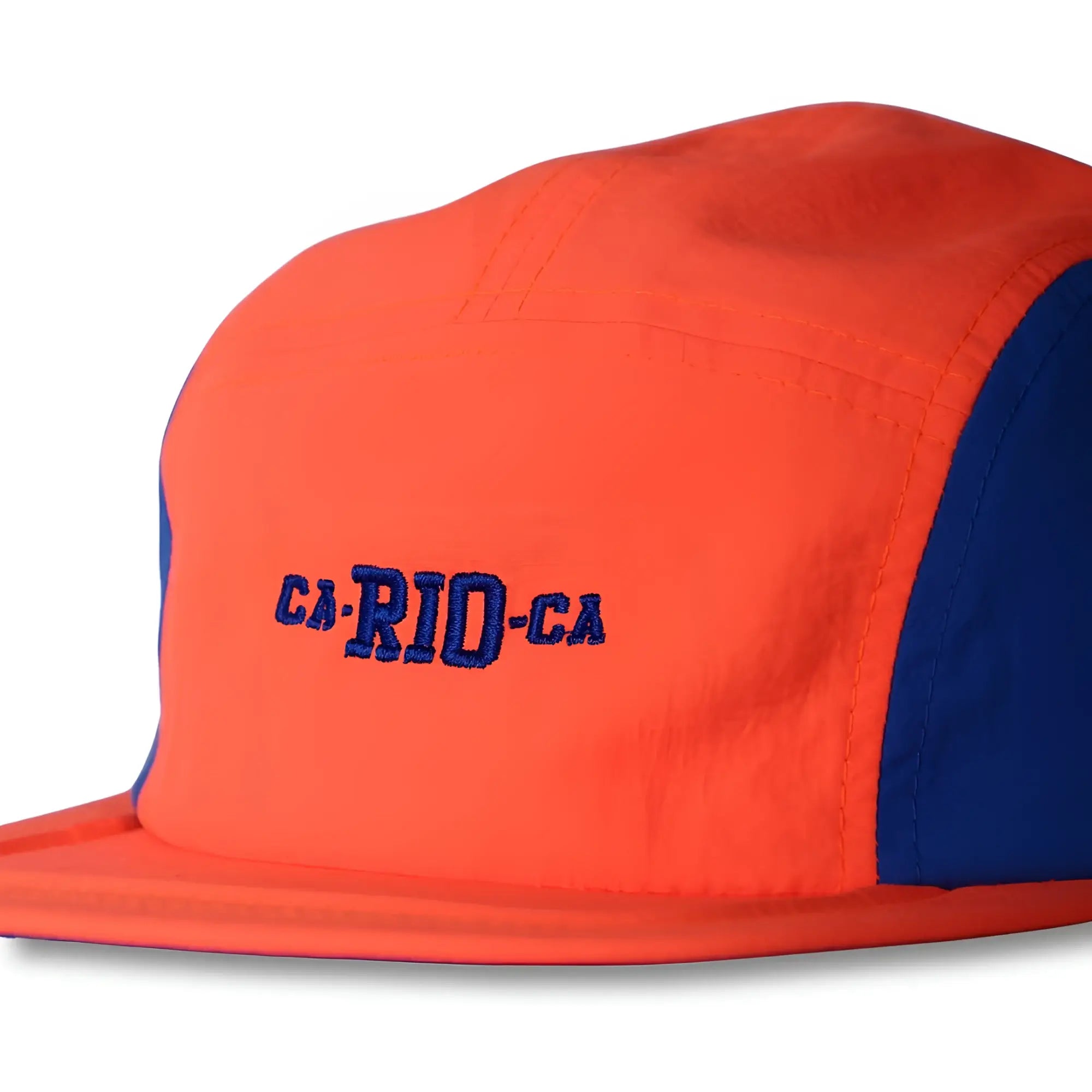 Vibrant orange and royal blue neon dream bike cap hat with ca-rio-ca embroidered in bold navy lettering