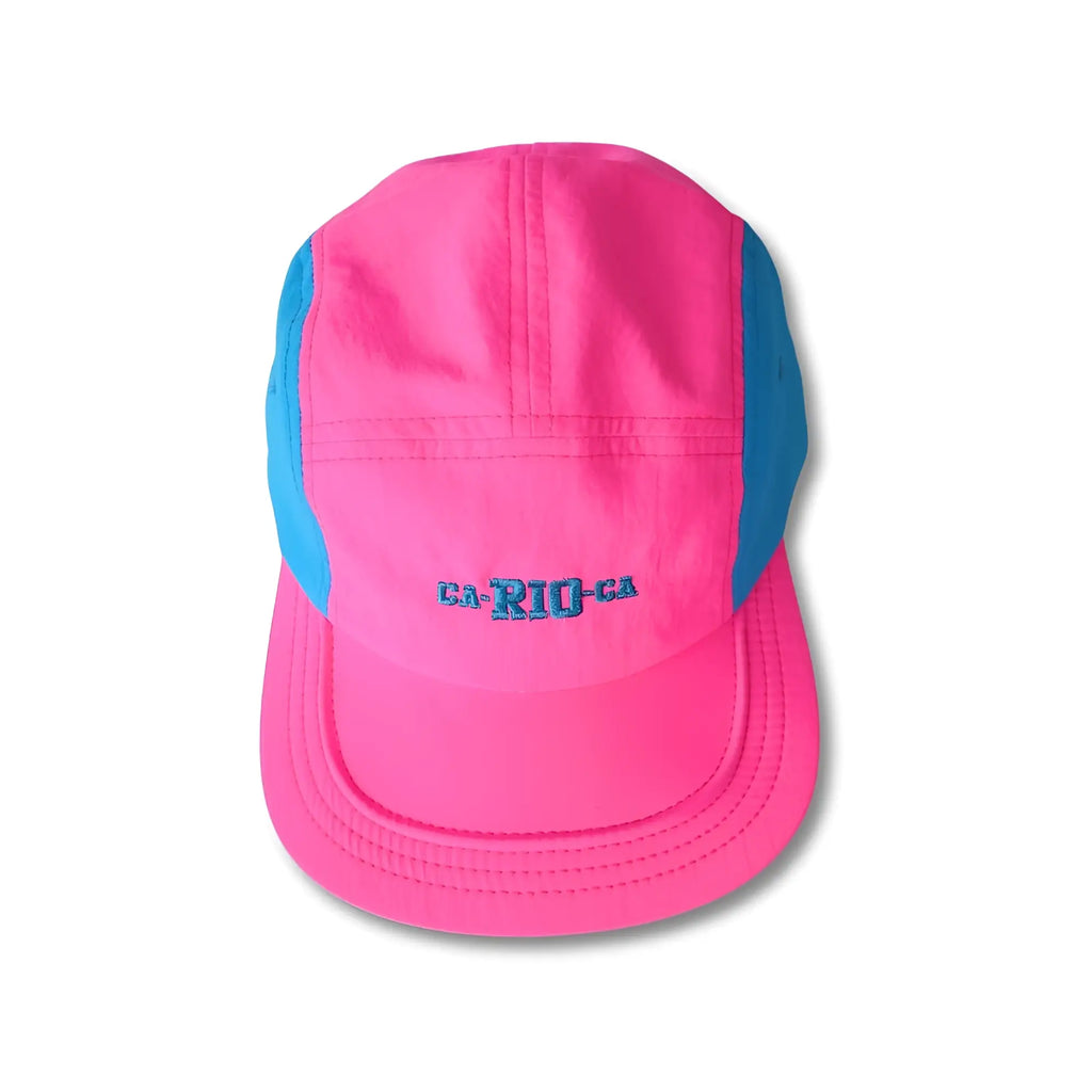 A vibrant pink and blue five-panel neon dream bike cap hat with ca-ri-o-ga embroidered in matching blue thread