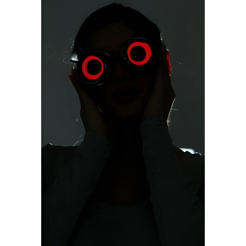 Red led-lit neon light up goggles with circular glowing lenses designed for vibrant night use