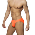 Bright orange neon swim bikini with snug form-fitting swim trunks and small logo on the waistband