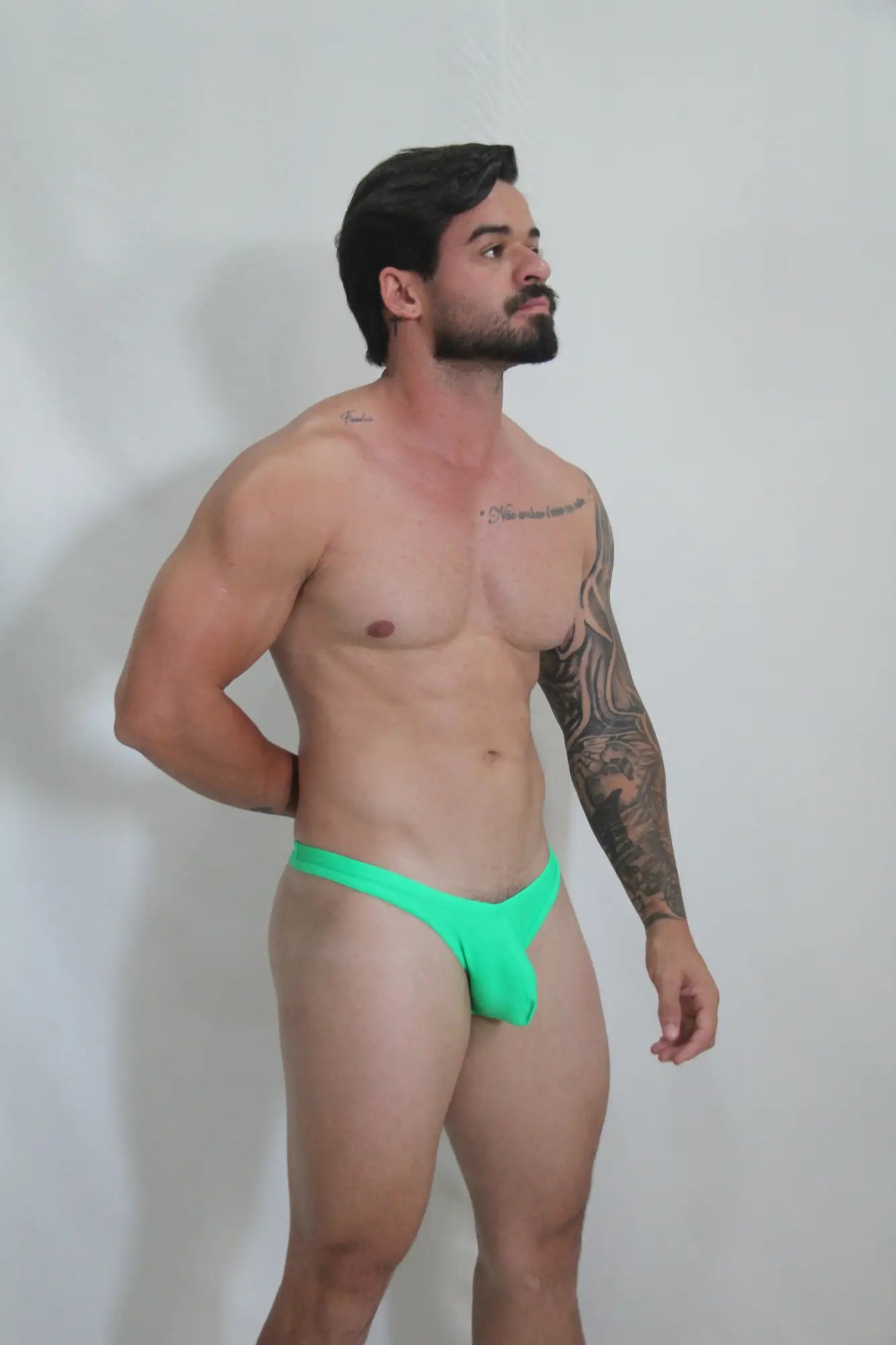 Vibrant neon green swim thong with snug form fitting design available in 4 colors for beachwear