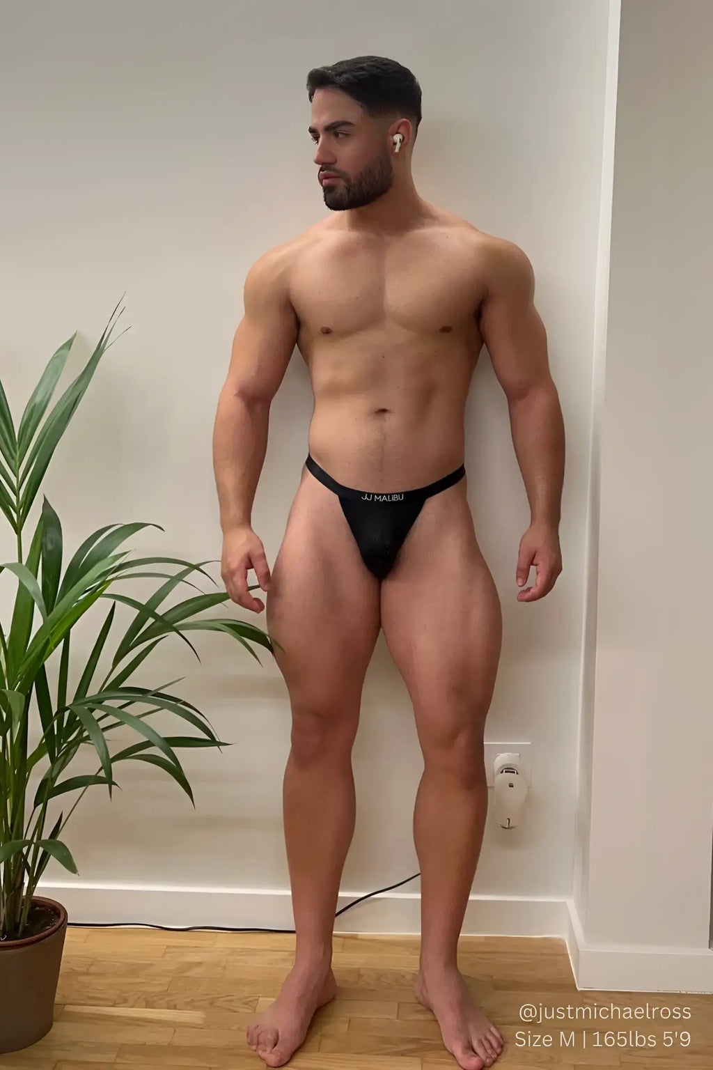 Black j now-or-never mesh thong in black showing breathable mesh material and sleek thong design from the back side