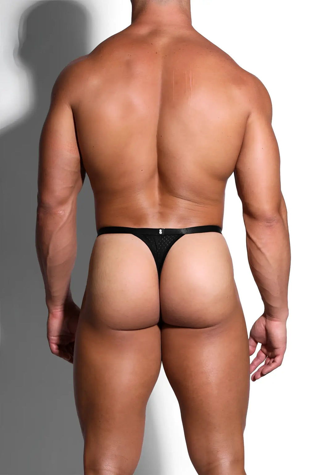 Black mesh thong with a sleek minimalist design showcasing the back side of the now-or-never mesh thong black