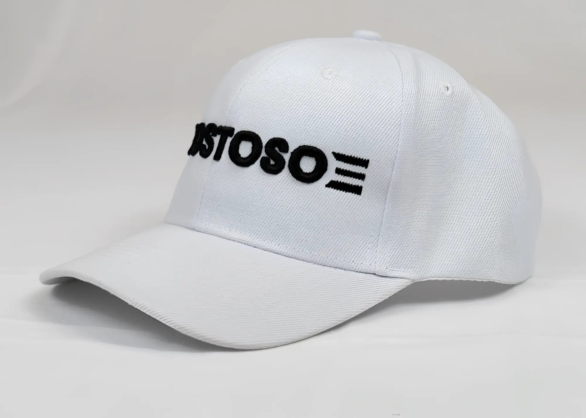 White baseball cap with black embroidered astoso logo featuring 3d puff gostoso stripes design