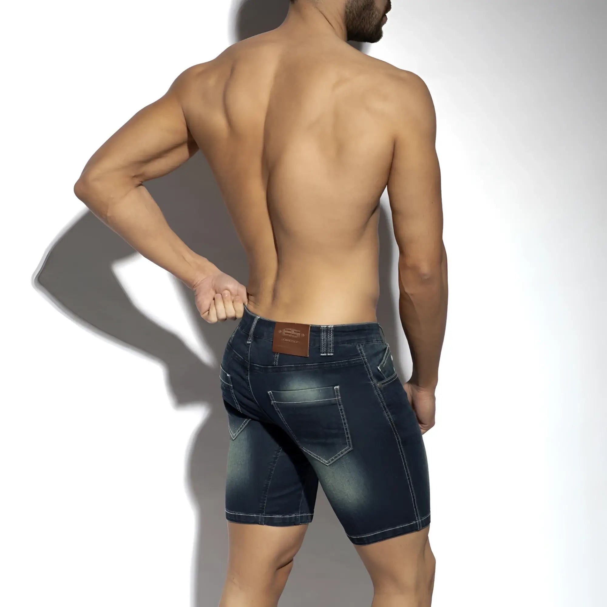Dark blue denim bermuda jeans shorts with faded wash and stitched pockets visible from the back side
