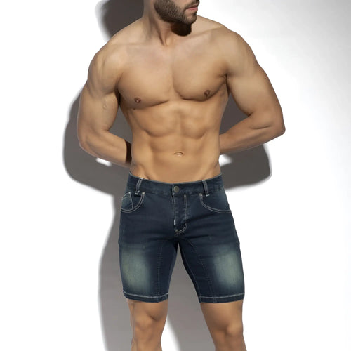 Dark blue denim bermuda jeans shorts with faded wash and classic stitching in a new denim style