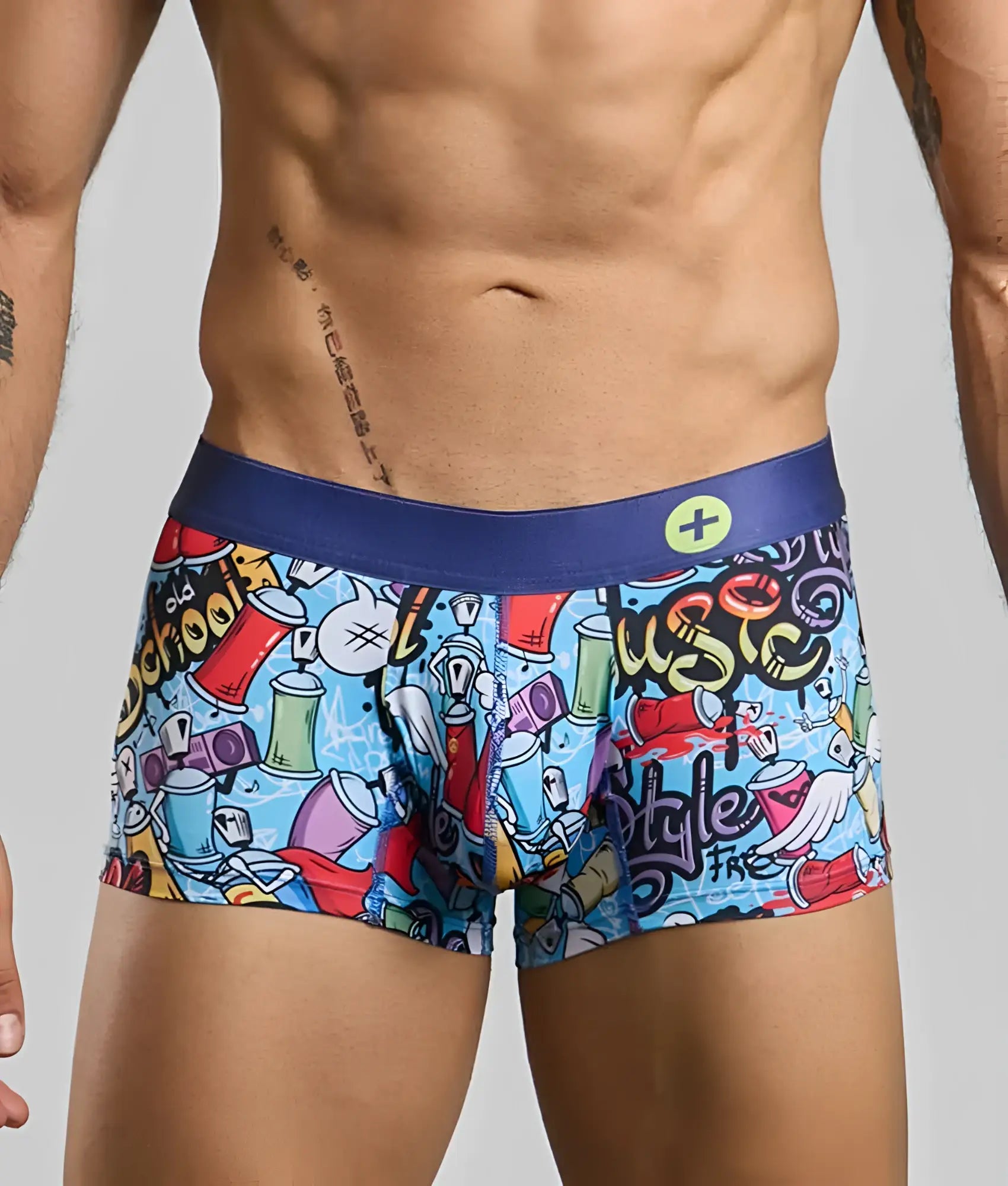 Vibrant graffiti-themed new malebasics trunk hipster men’s boxer briefs with blue waistband and colorful spray paint print on light blue fabric